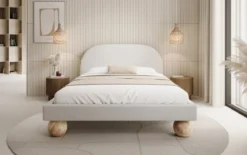 Designer Polsterbett Milo in Bouclé mit runden Holzfüßen