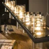Pendelleuchte "Melvira“ – 14 zylindrische Glasschirme in Bernstein- und Chromoptik