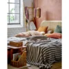 Zierkissen Tavira – Stickdesign in warmem Orangeton